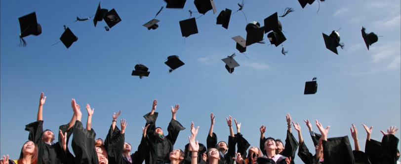 Students throw graduation caps