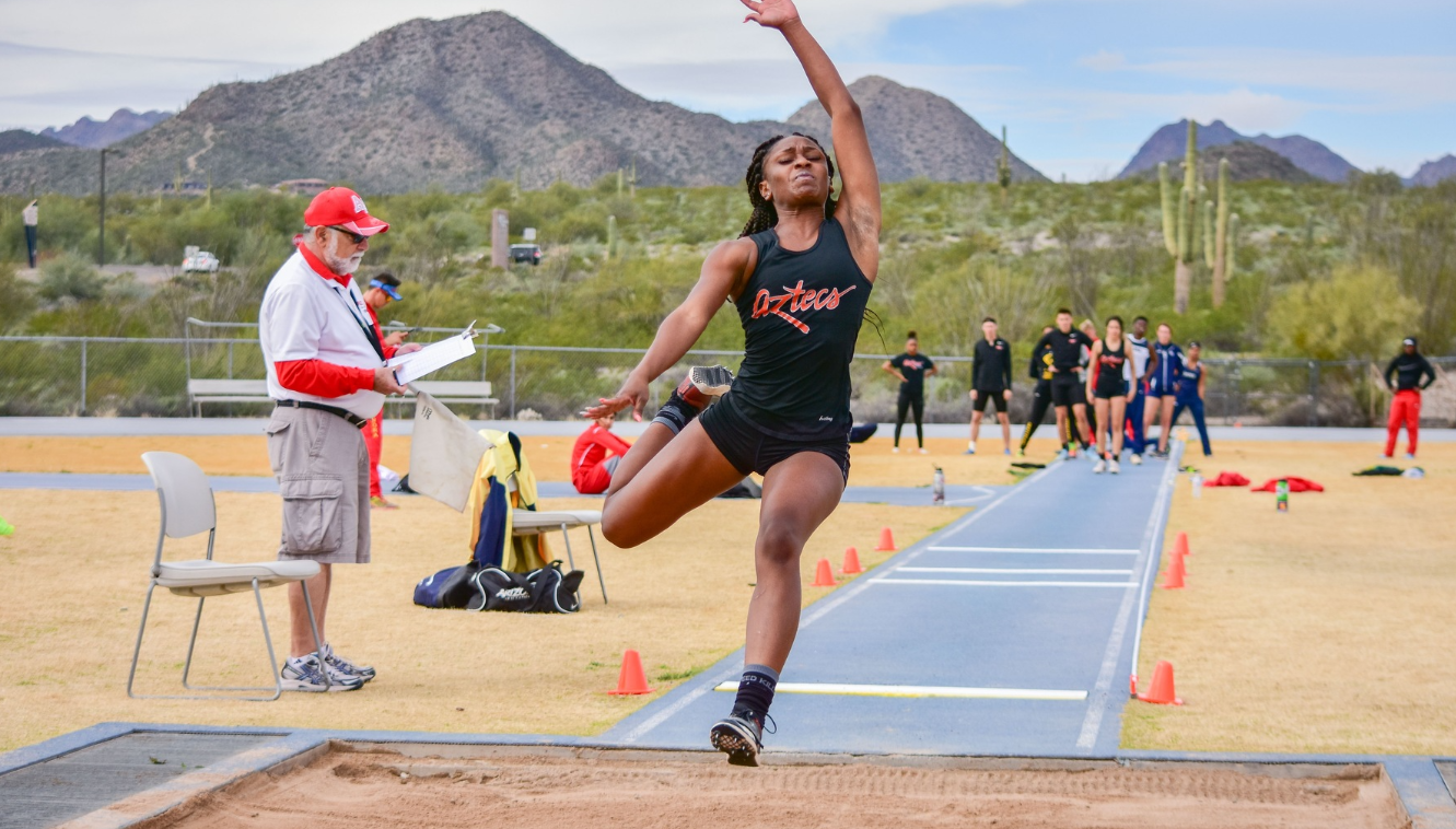 Female student does the long jump